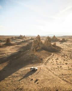 Aerial photography showcasing the striking Trona Pinnacles geological formations in a desert landscape.
